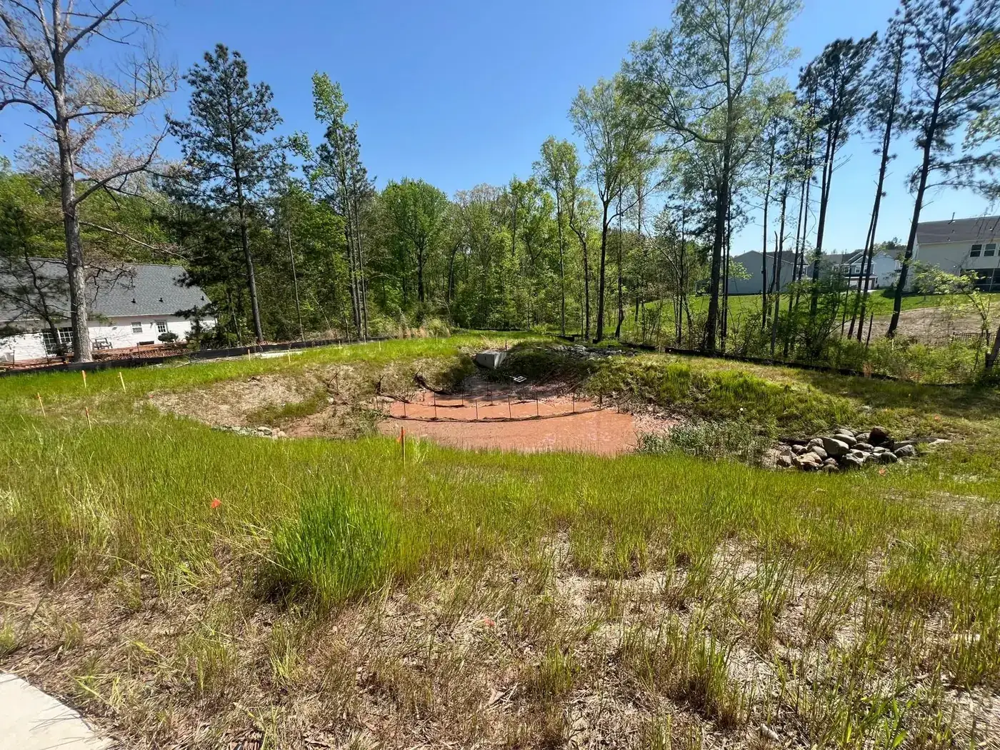 Eroded bioretention basin before Delcid's work