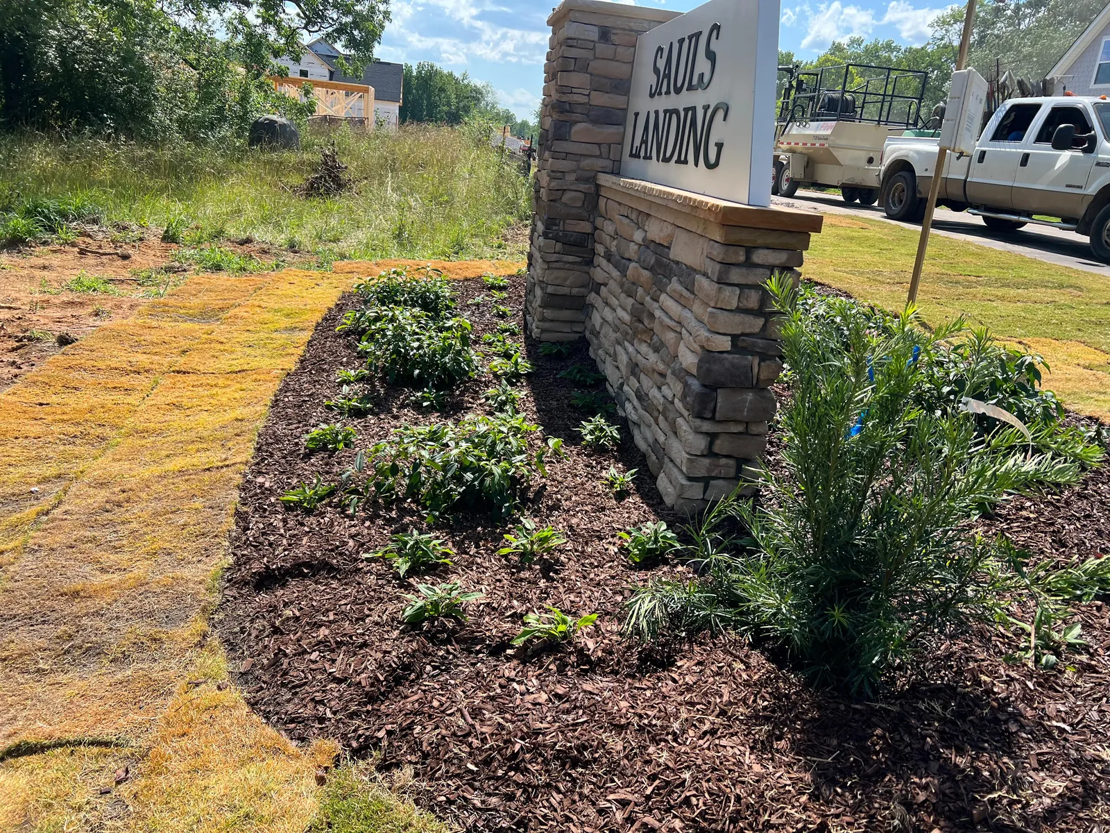 Sauls Landing entrance sign with new mulch beds and plantings