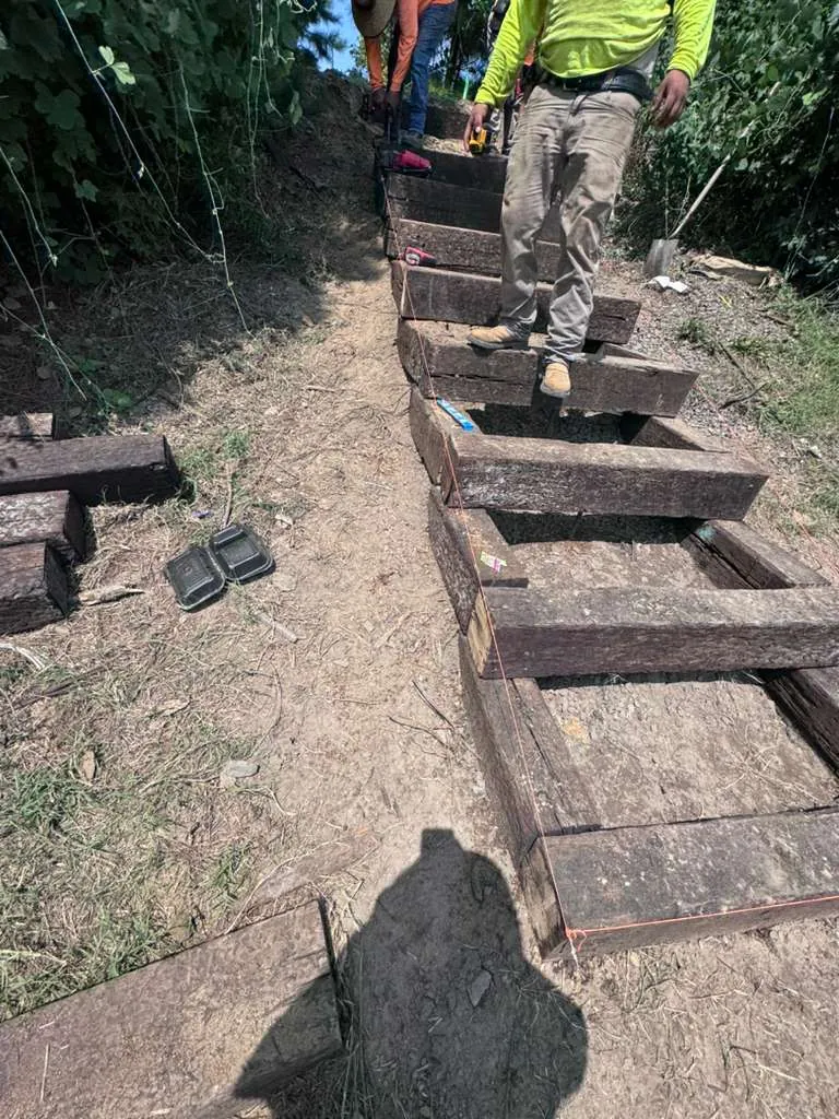 Crew building a community park staircase at Midtown Rows