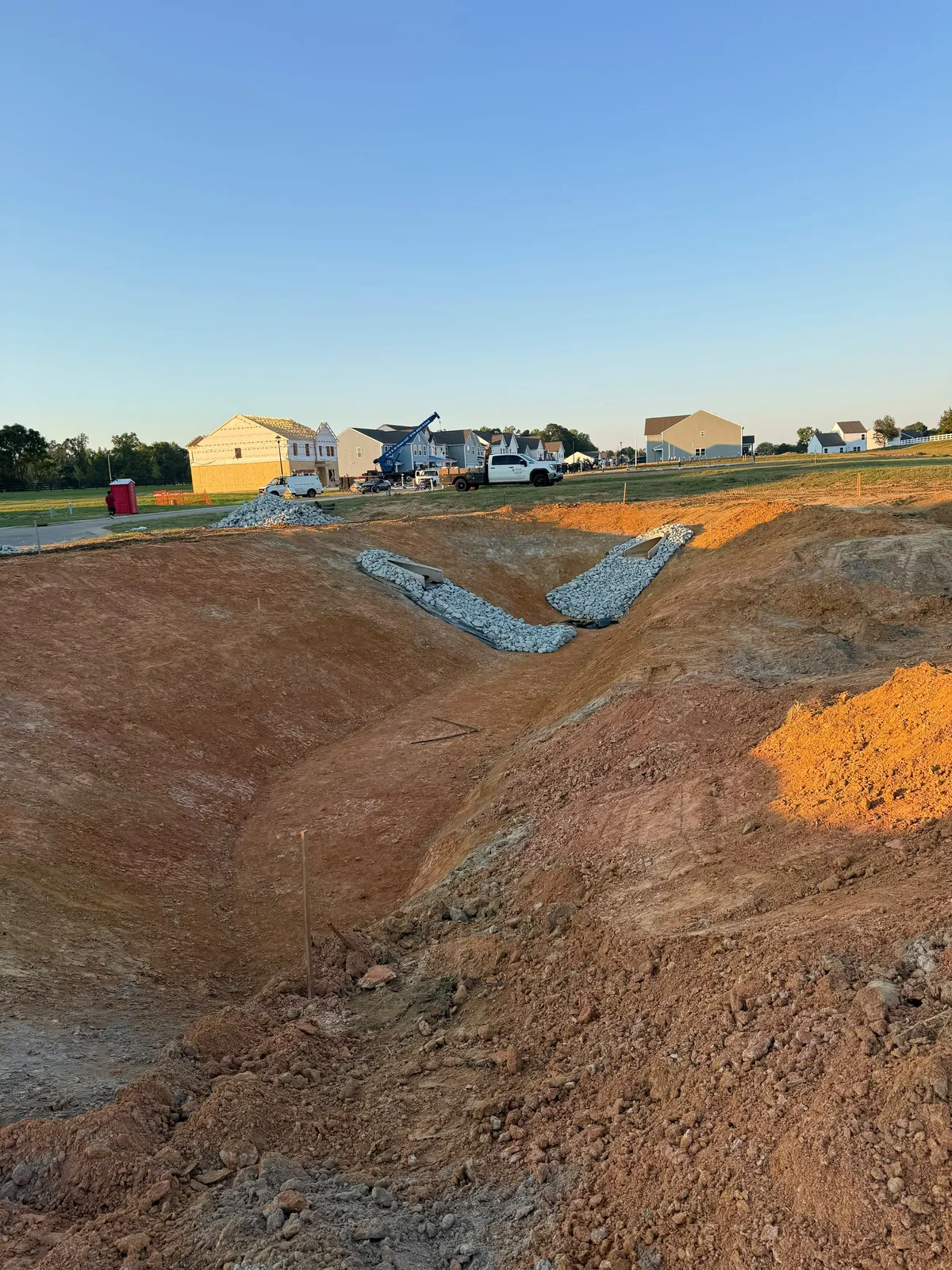 Rip-rap channel across the basin floor at Nathans Ridge Pond 1
