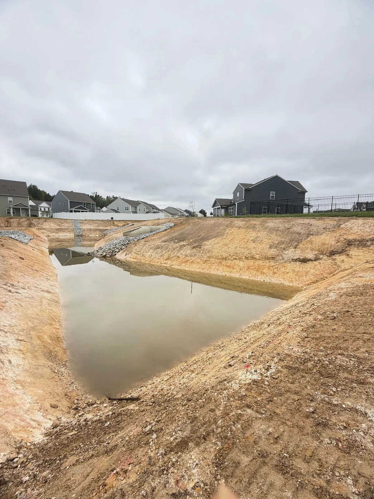 Graded basin after rain at Nathans Ridge Pond 2