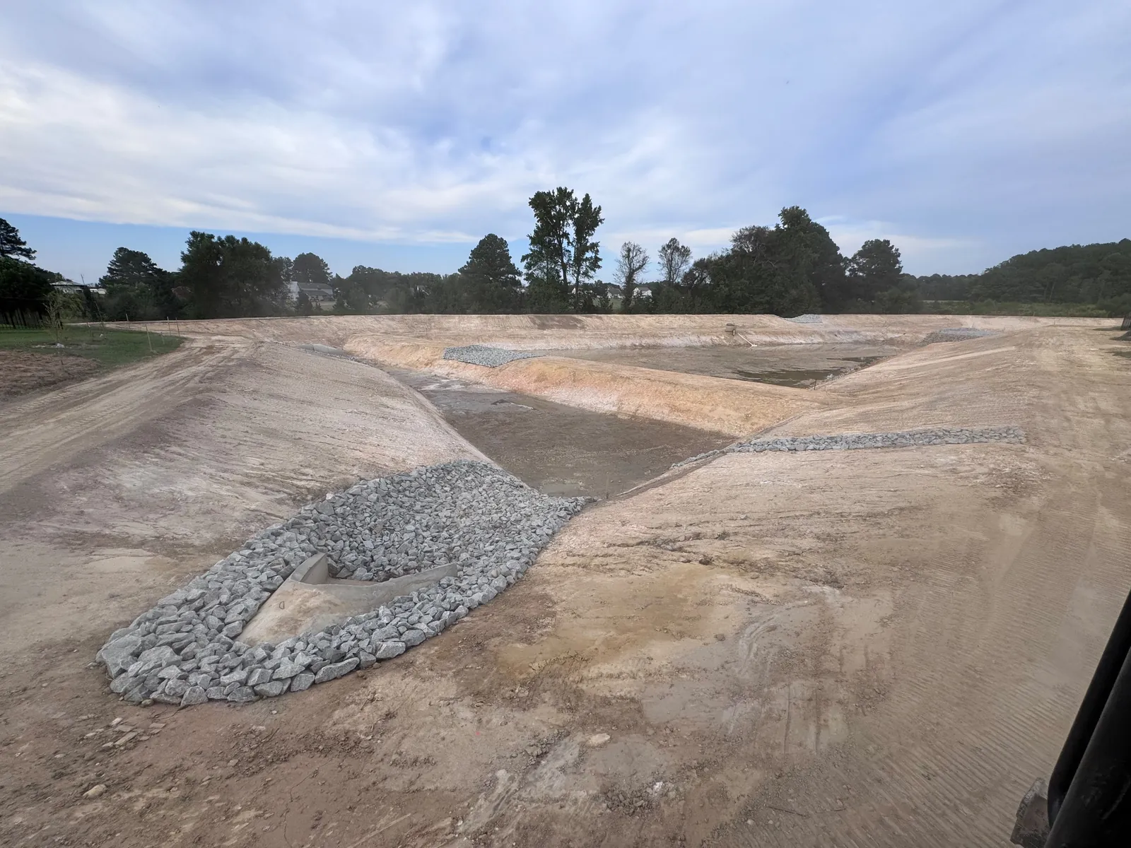 Rip-rap ring at the graded basin at Nathans Ridge Pond 2