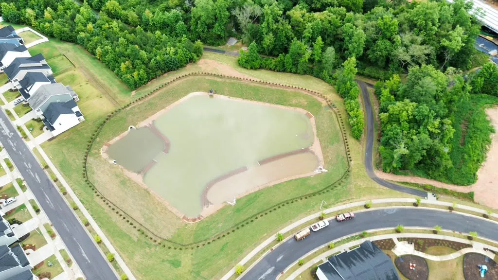Aerial view of the finished pond with established sod and matting