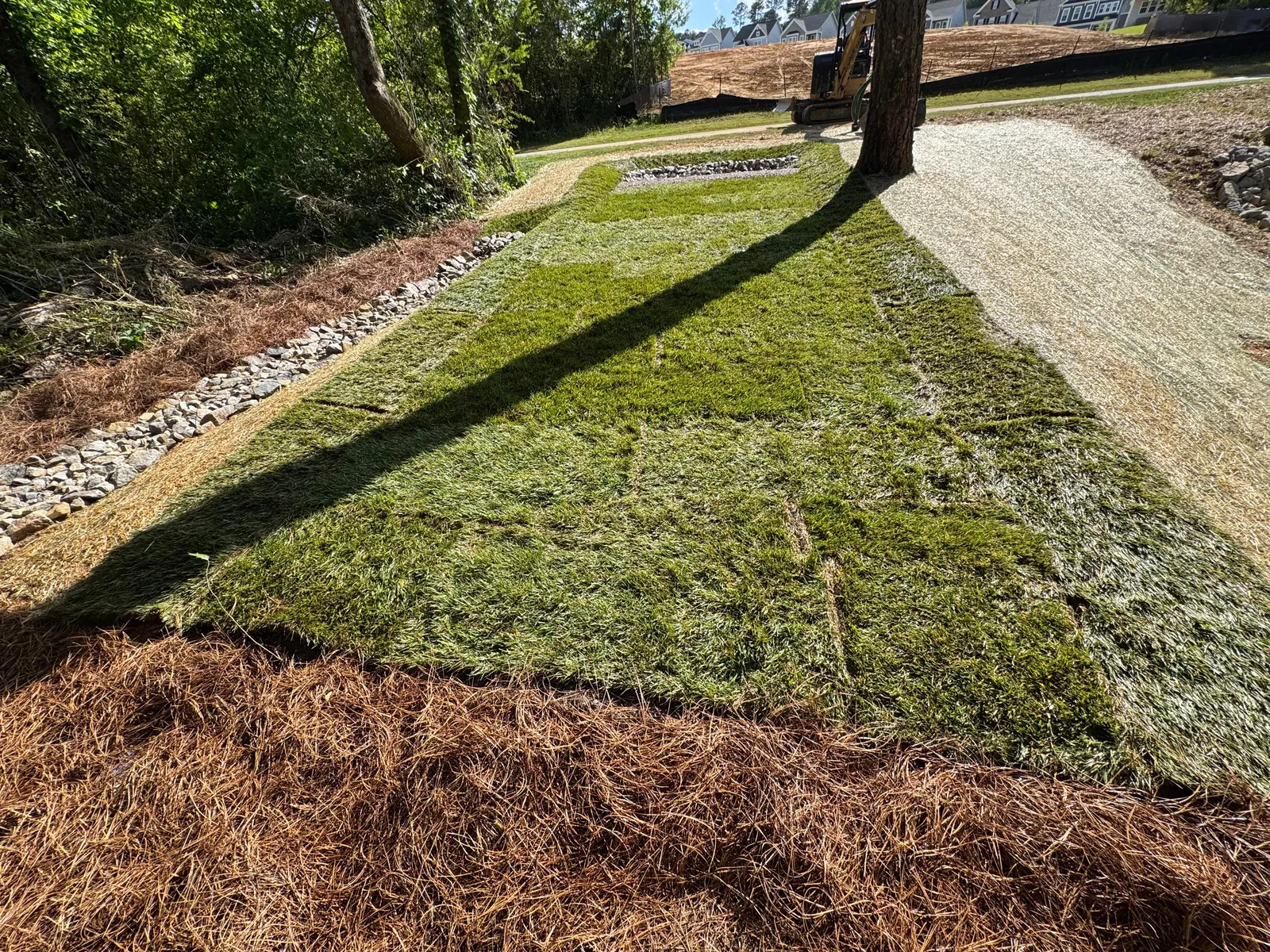 Sodding around a finished level spreader at Renaissance at White Oak