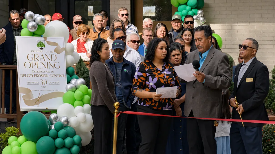 Carlos Lopez addressing the crowd at the Delcid Grand Opening ribbon cutting
